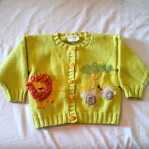 Handmade safari sweater with a lion, elephant, and giraffe decorations